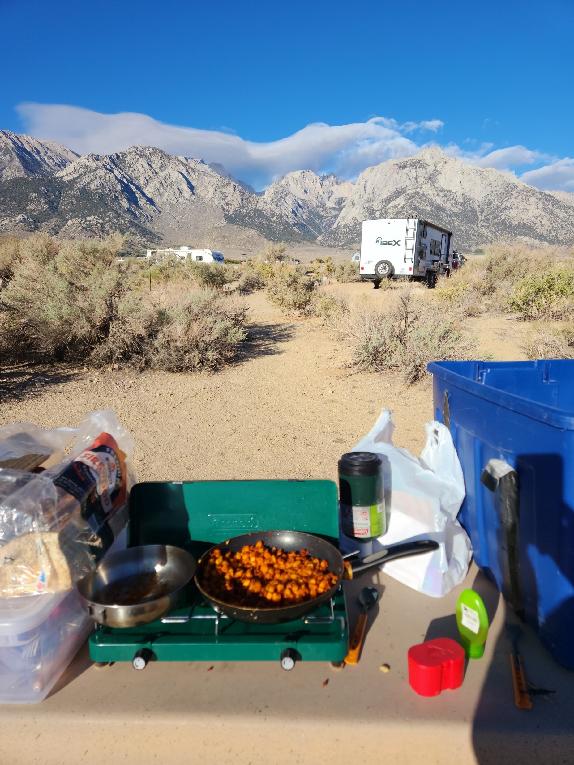 Cooking breakfast burritos on a camp stove in the Alabama Hills, looking at the Sierra Nevada mountain range in Nevada