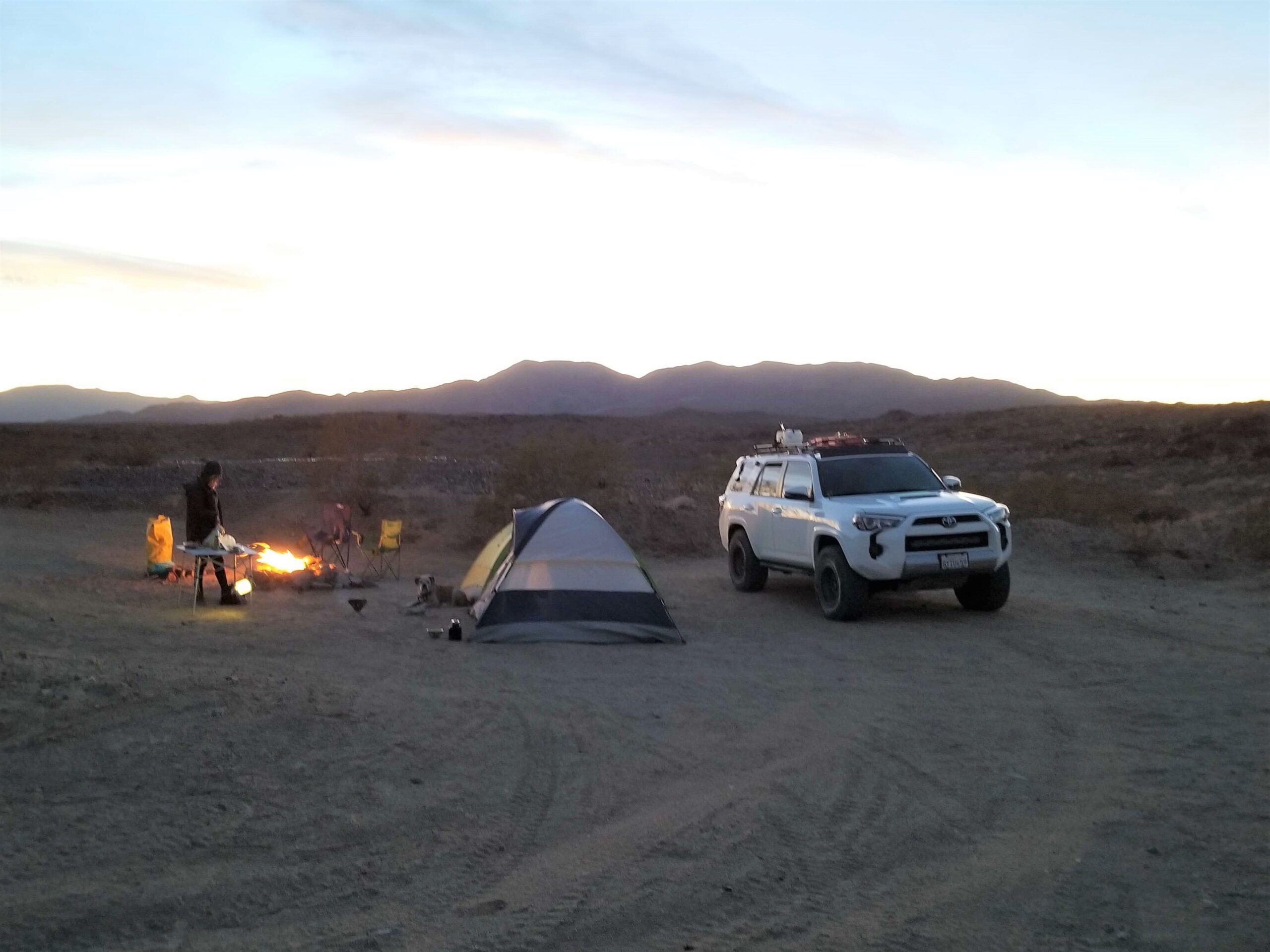 Lifted Toyota 4runner, tent, and campfire in the desert near Joshua Tree National Park