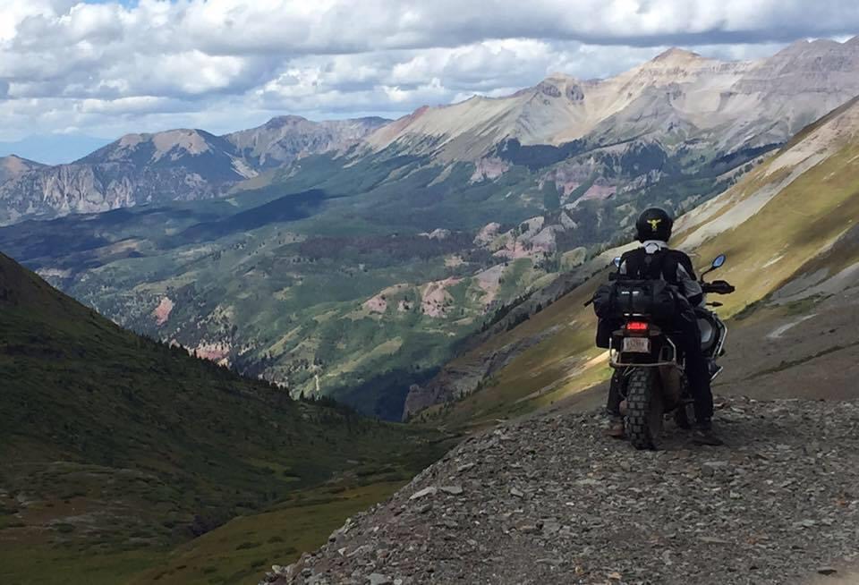 Motorcycle rider on BMW 1200GS in the San Juan mountains of southwestern Colorado